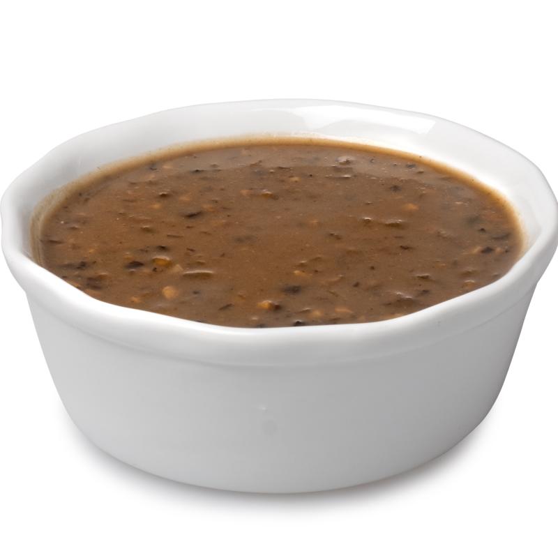 Mushroom gravy in a small serving bowl