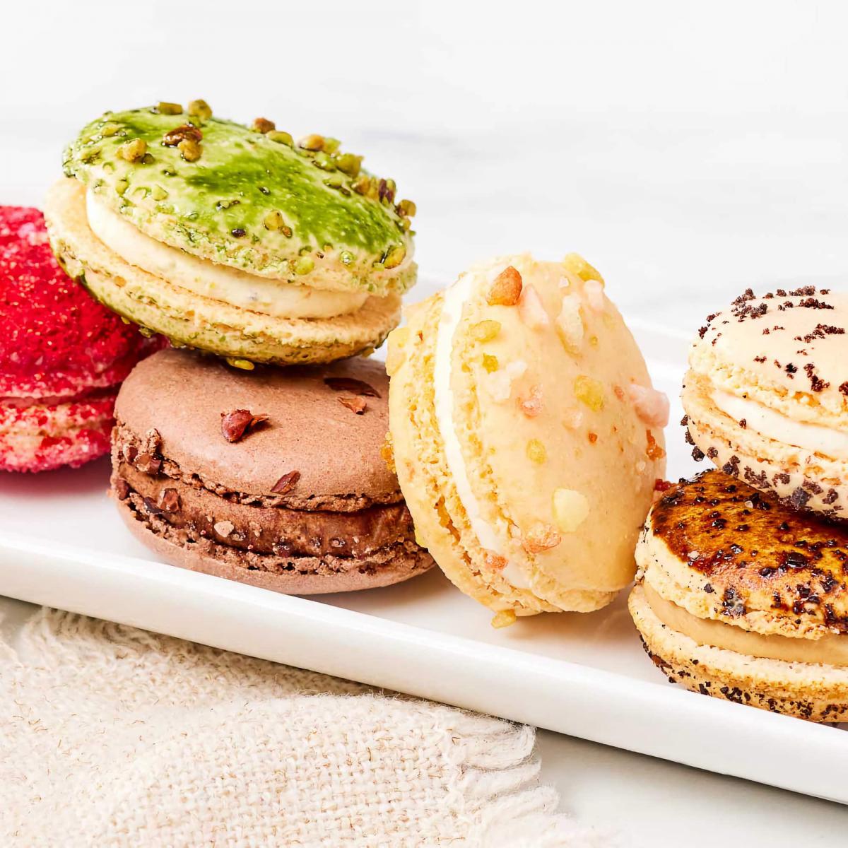 Six different varieties of macarons on a plate