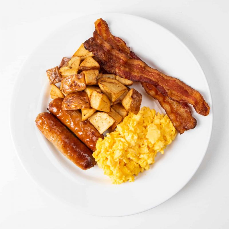 A la carte breakfast with bacon, sausage, potatoes and scrambled eggs