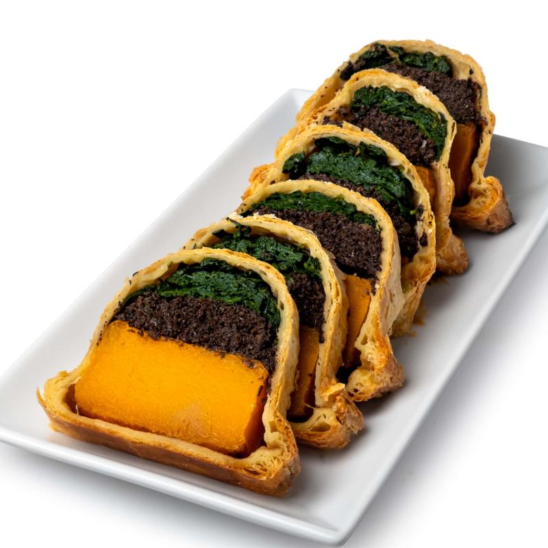 Sliced vegan butternut squash Wellington on a platter