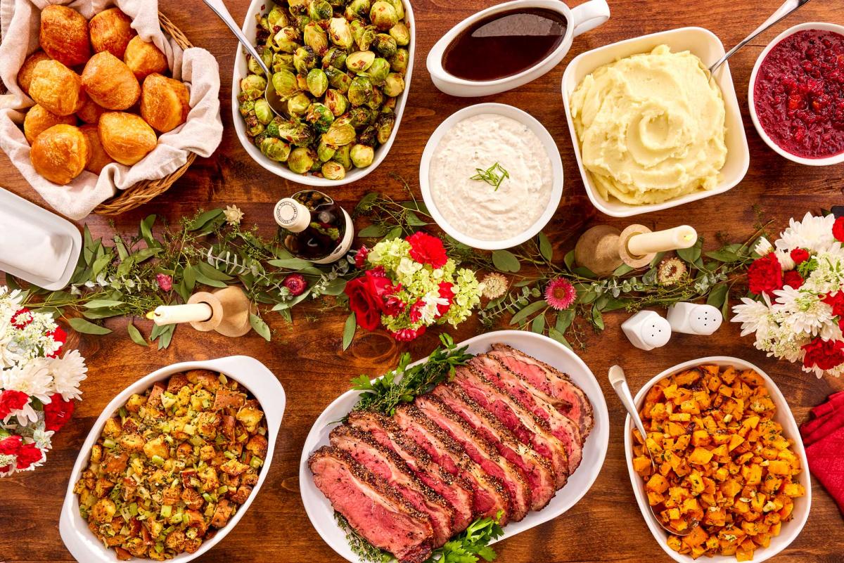 Holiday contemporary meal with New York roast portioned for 8-10 on a styled table setting