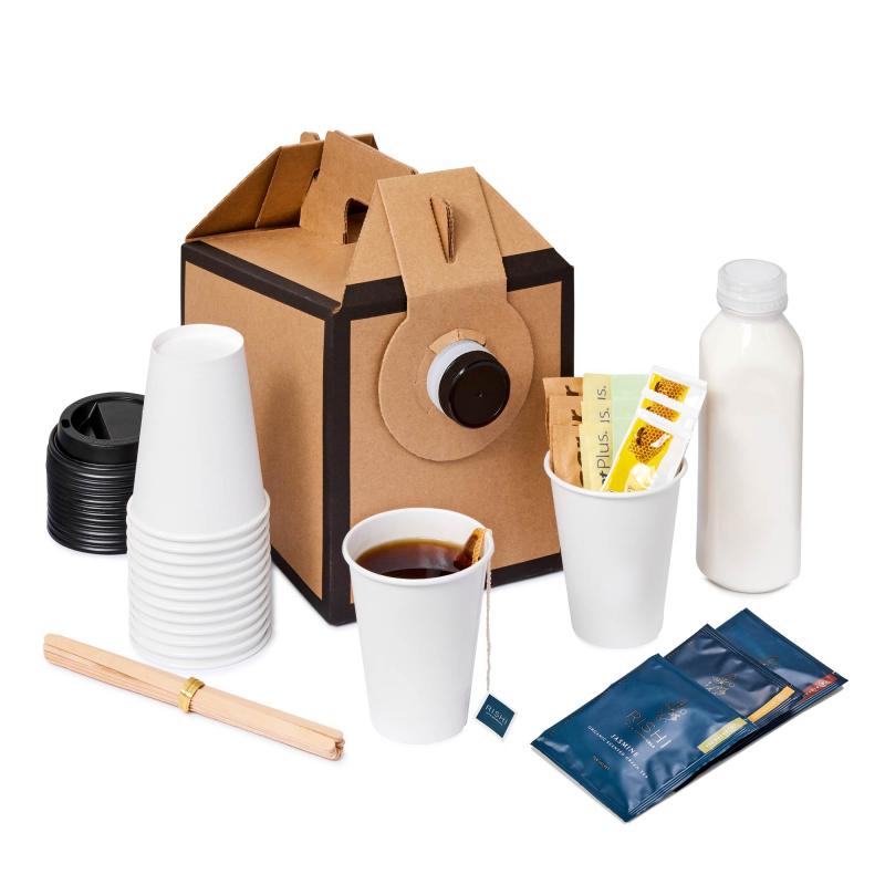 A small disposable tea dispenser with a stack of cups, lids, stir sticks, sweeteners, honey, and a bottle of cream.
