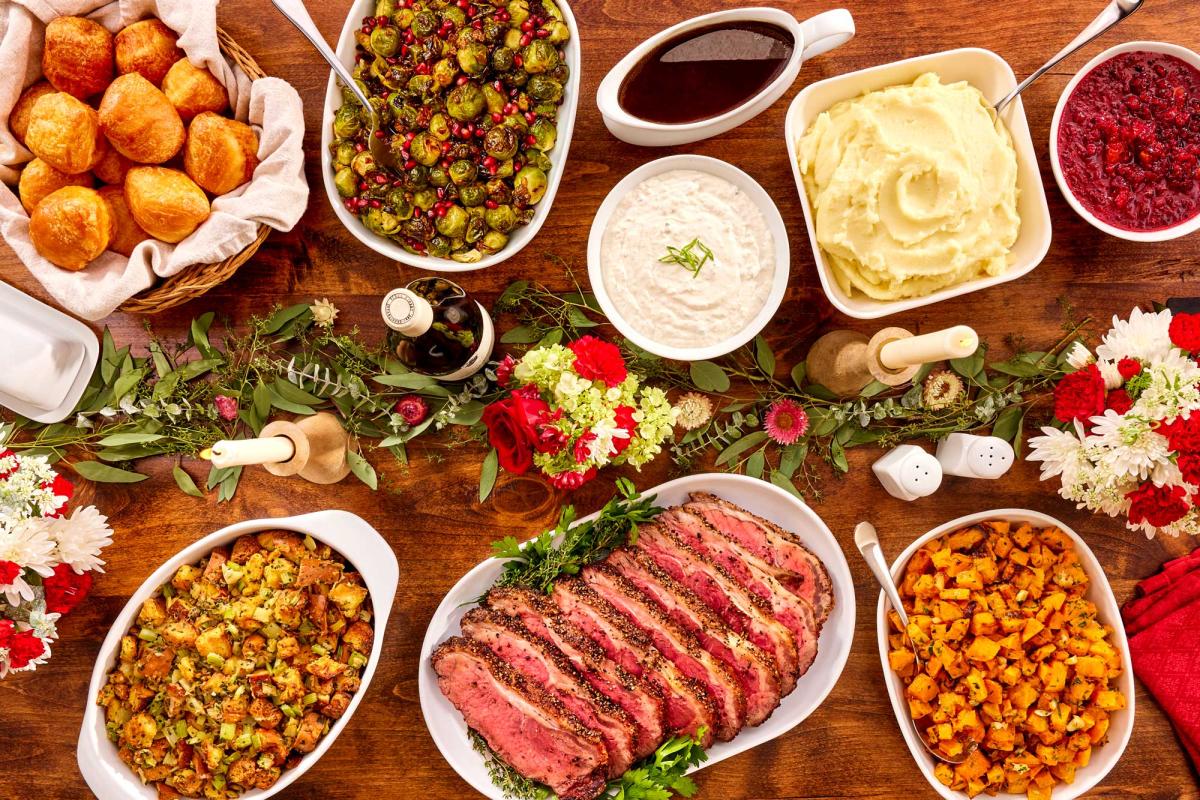 Holiday contemporary meal with New York roast portioned for 8-10 on a styled table setting